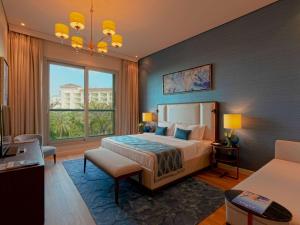 Postel nebo postele na pokoji v ubytování Rixos The Palm Hotel & Suites - Ultra All Inclusive