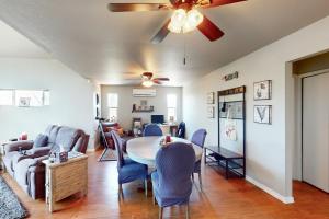 a living room with a table and chairs at The Forest Cottage in Payson