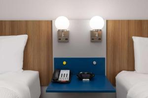 Postel nebo postele na pokoji v ubytování Microtel Inn & Suites by Wyndham Buda Austin South