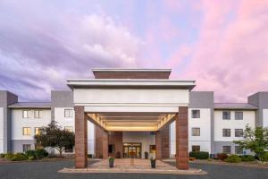 a rendering of the front of a white building at La Quinta by Wyndham Kokomo in Kokomo