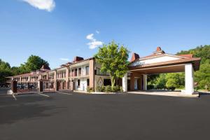 an empty parking lot in front of a building at Days Inn by Wyndham Helen in Helen
