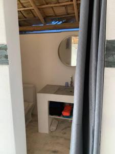 a bathroom with a sink and a mirror at EL Cielo de Cana in Las Terrenas +29 photos
