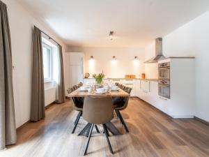 a dining room with a table and chairs in a kitchen at Heimelig L in Saalbach-Hinterglemm