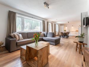 a living room with a couch and a table at Heimelig L in Saalbach-Hinterglemm