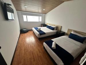 Hotel Embajada Bogota DC客房内的一张或多张床位