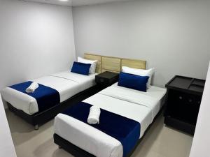 Hotel Embajada Bogota DC客房内的一张或多张床位