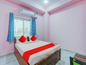 Postel nebo postele na pokoji v ubytování Hotel O Kalinga Inn + 23 fotografií