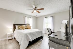 a bedroom with a bed and a ceiling fan at 18 Mi to Dtwn Atlanta Pet-Friendly Home with Yard! in Union City
