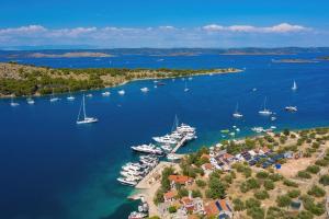an aerial view of a harbor with boats in the water at Rooms by the sea Cove Golubovac, Kornati - 23062 in Bizikovica