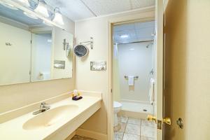 a bathroom with a sink and a toilet at Town & Country Inn & Resort in Gorham