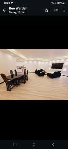 a picture of a living room with wooden furniture at Avenue soleil sur mer flic en flac in Flic-en-Flac