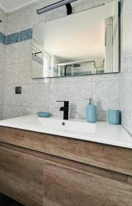 a bathroom with a sink and a mirror at Saladi Beach House in Didyma +37 photos