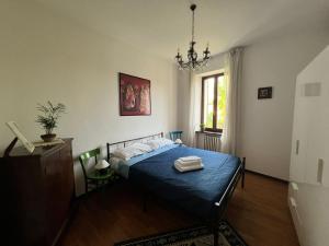 Postel nebo postele na pokoji v ubytování Corte L'Ovo - Country House 15 minutes from the heart of Verona