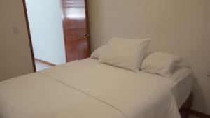 Postel nebo postele na pokoji v ubytování Orizaba Suites