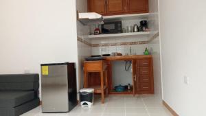 Kuchyň nebo kuchyňský kout v ubytování Orizaba Suites