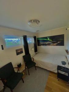 En TV eller et underholdningssystem på Apartment with parking and sauna