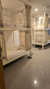 Postel nebo postele na pokoji v ubytování Malee Hotel