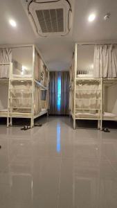Postel nebo postele na pokoji v ubytování Malee Hotel