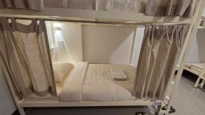 Postel nebo postele na pokoji v ubytování Malee Hotel