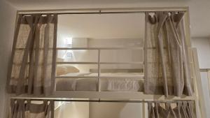 Postel nebo postele na pokoji v ubytování Malee Hotel