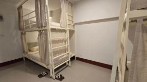 Postel nebo postele na pokoji v ubytování Malee Hotel