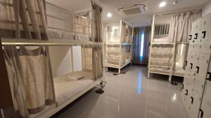 Postel nebo postele na pokoji v ubytování Malee Hotel
