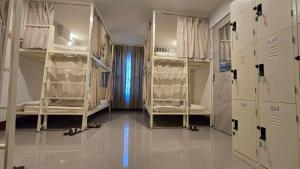 Postel nebo postele na pokoji v ubytování Malee Hotel