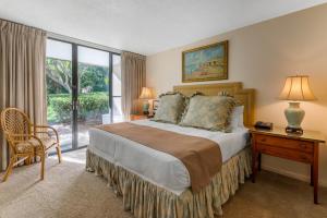 Ένα ή περισσότερα κρεβάτια σε δωμάτιο στο Villas Of Amelia Island