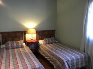 Łóżko lub łóżka w pokoju w obiekcie Casa Rural La Alcornocosa