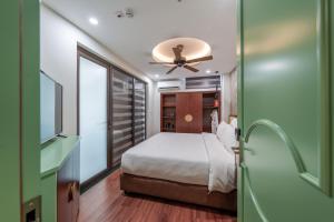 Voodi või voodid majutusasutuse Lestar Hotel Hanoi toas