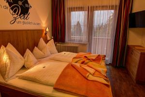 Letto o letti in una camera di Der Brückenhof Ramsau
