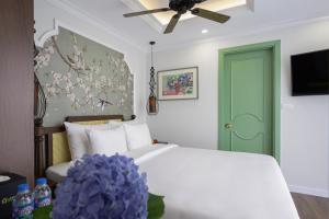 Voodi või voodid majutusasutuse Lestar Hotel Hanoi toas