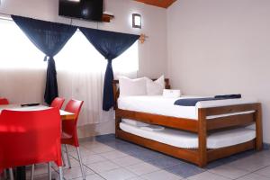 Ein Bett oder Betten in einem Zimmer der Unterkunft Bungalows Yeah Los Ayala