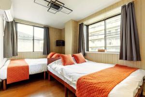 Postel nebo postele na pokoji v ubytování 立石5丁目m201