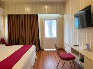 TV a/nebo společenská místnost v ubytování Grand Tamaro Hotel