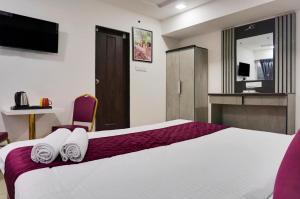 Postel nebo postele na pokoji v ubytování Hotel Orchard Park + 19 fotografií