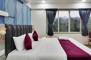 Postel nebo postele na pokoji v ubytování Hotel Orchard Park