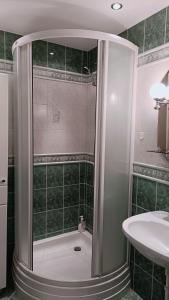 a bathroom with a shower and a sink at Sky&Lake Apartments Gdańsk in Gdańsk +24 photos
