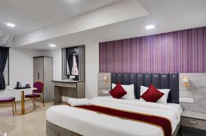 Postel nebo postele na pokoji v ubytování Hotel Orchard Park