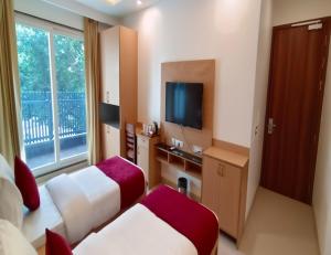 Μια τηλεόραση ή/και κέντρο ψυχαγωγίας στο Haris Court- Cyber Hub