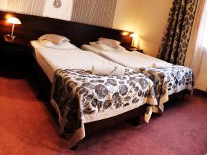 Posteľ alebo postele v izbe v ubytovaní Hotel Monet & Rubbens