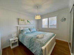 Jo Sea - New build, Luxury in Vincentia with Ocean Views客房内的一张或多张床位