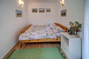 Postel nebo postele na pokoji v ubytování Apartmani ZELENI MEDA