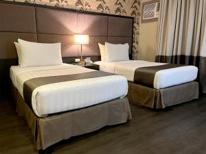 Postel nebo postele na pokoji v ubytování Hotel Del Rio