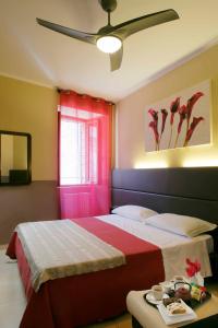 Kama o mga kama sa kuwarto sa Hotel Properzio