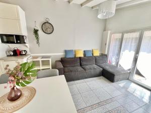 a living room with a couch and a table at Little house 2 bedrooms -Terrace, Antony Center near Paris and Orly in Antony