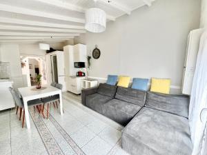 a living room with a couch and a table at Little house 2 bedrooms -Terrace, Antony Center near Paris and Orly in Antony