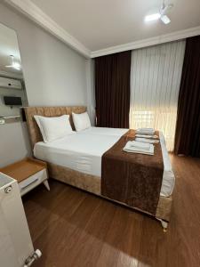 A bed or beds in a room at Tavra hotel