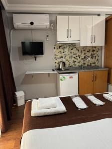 A bed or beds in a room at Tavra hotel