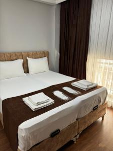 A bed or beds in a room at Tavra hotel
